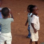 Children playing on a dirt ground
