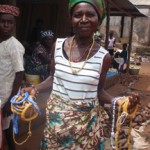 Woman selling colorful beaded necklaces at market