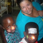 Woman with two children wearing face stickers